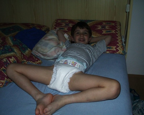 8 year old diaper boy Tommy wearing diapers plastic pampers