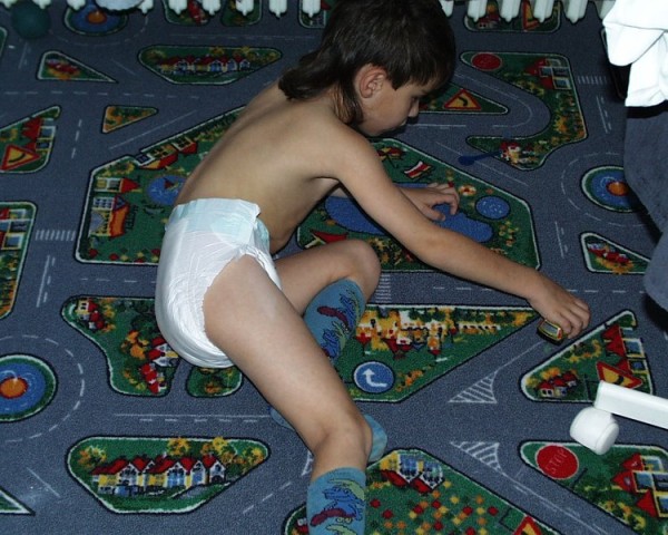 8 year old boy playing in diapers