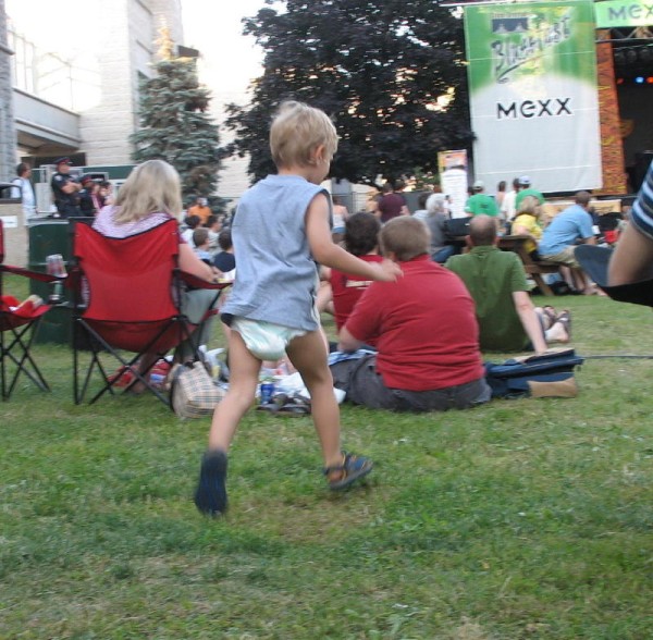 3 year old boy wearing diaper shirt and sandals in public